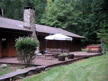 An almost 600 sq. ft. deck that has doors off the kitchen, living area and master bedroom suite, provide luxurious outdoor living.  Use the hot tub, have your wedding there (as this owner did), or just relax and read, or, hike on the totally secluded and undisturbed surrounding acreage.