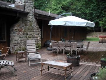 An almost 600 sq. ft. deck that has doors off the kitchen, living area and master bedroom suite, provide luxurious outdoor living.  Use the hot tub, have your wedding there (as this owner did), or just relax and read, or, hike on the totally secluded and undisturbed surrounding acreage.