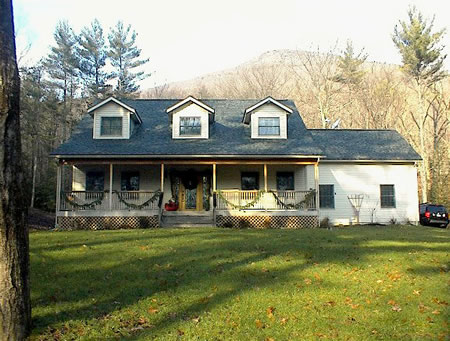 Room to grow with unfinished basement, 2-car heated garage. Decks off almost every room make this home country living at it's best!!