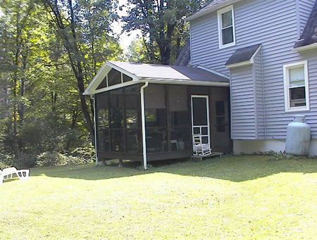Lovely semiprivate back yard with screened porch.