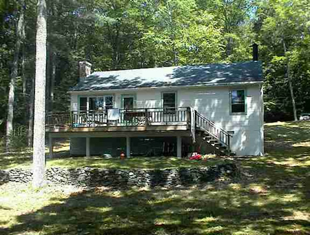 Wood floors, fireplace and screened porch on almost 2 acres with privacy, views and amazing rock outcroppings.
