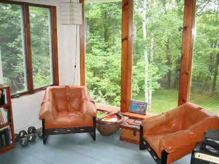 Finished walk out basement with woodstove and mexican tile floor. New heating system, outbuilding for potential studio. This quintessential Woodstock home is a must see!